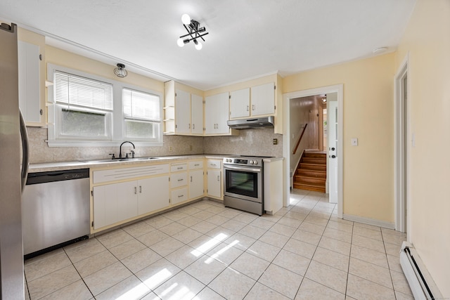81 Summit St, Southington, CT 06489 - kitchen featuring appliances with stainless steel finishes, under cabinet range hood, a baseboard radiator, a sink, and light tile patterned floors