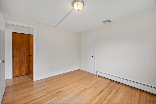 81 Summit St, Southington, CT 06489 - spare room with baseboard heating, wood finished floors, and baseboards