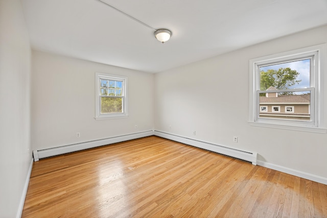 81 Summit St, Southington, CT 06489 - empty room featuring healthy amount of natural light, baseboard heating, wood finished floors, and baseboards