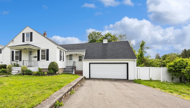 81 Summit St, Southington, CT 06489 - view of front of property with a chimney, asphalt driveway, a garage, and a shingled roof