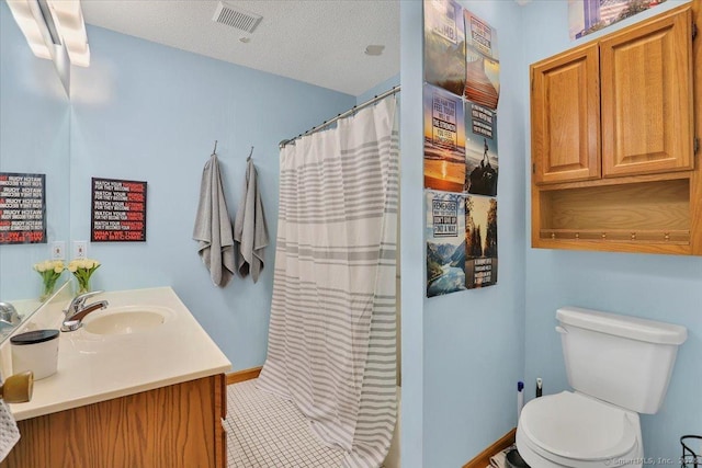 full bathroom featuring toilet, vanity, curtained shower, and tile patterned floors