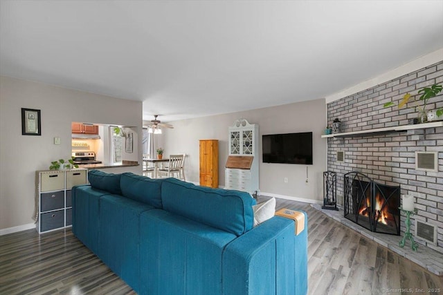 44 Mohawk Trl Unit 44, Guilford, CT 06437 - living room with wood finished floors, a fireplace, and baseboards