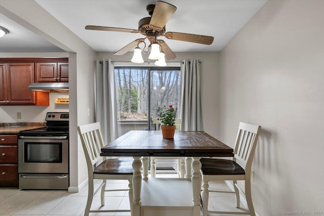 44 Mohawk Trl Unit 44, Guilford, CT 06437 - dining space with ceiling fan, baseboards, and light tile patterned floors