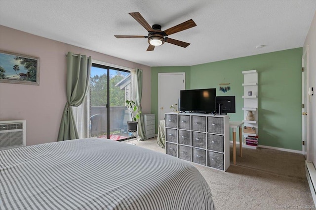 44 Mohawk Trl Unit 44, Guilford, CT 06437 - carpeted bedroom featuring a ceiling fan, a textured ceiling, access to outside, and a baseboard radiator