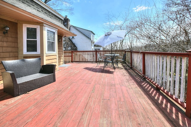 deck with outdoor dining space
