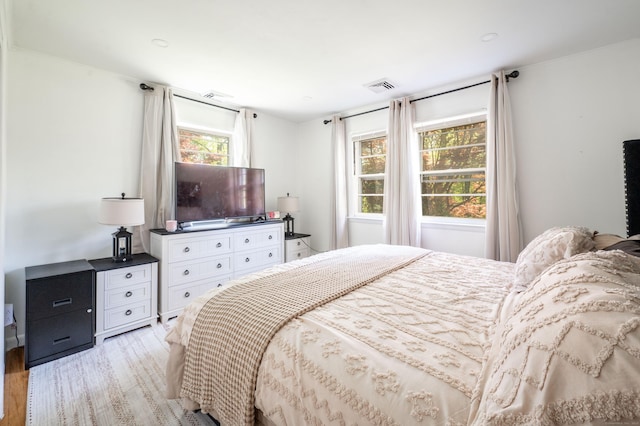 bedroom with light wood finished floors