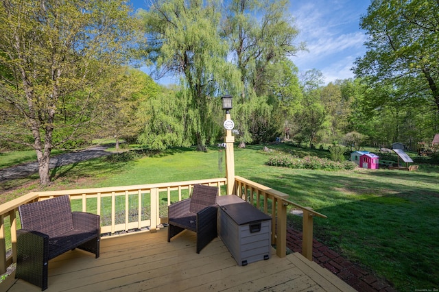 wooden terrace featuring a yard