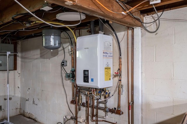 utility room featuring water heater and electric panel