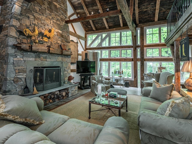 39 Painter Hill Rd, Woodbury, CT 06798 - living room with high vaulted ceiling, a fireplace, plenty of natural light, and wood finished floors