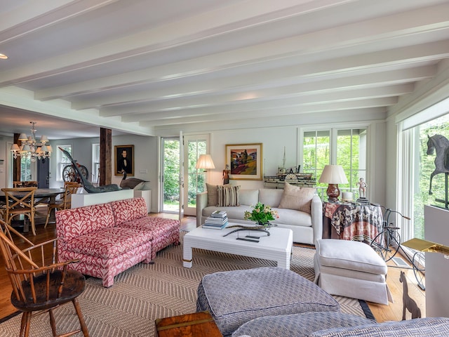 39 Painter Hill Rd, Woodbury, CT 06798 - living room with beam ceiling, plenty of natural light, a chandelier, and wood finished floors