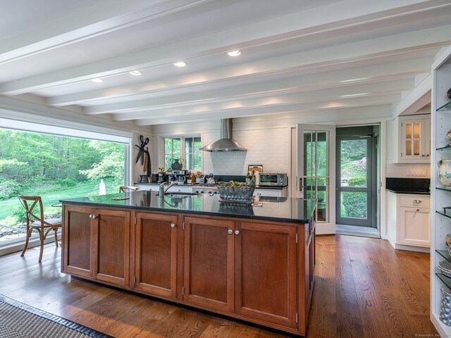 39 Painter Hill Rd, Woodbury, CT 06798 - kitchen with wall chimney range hood, dark countertops, backsplash, beam ceiling, and dark wood-style floors