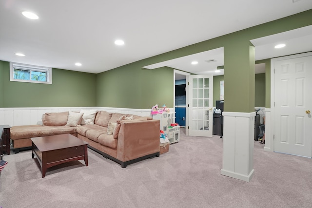 living area featuring light carpet, visible vents, and recessed lighting