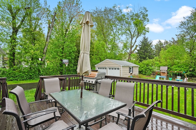 wooden deck featuring area for grilling, a yard, an outbuilding, a playground, and outdoor dining area