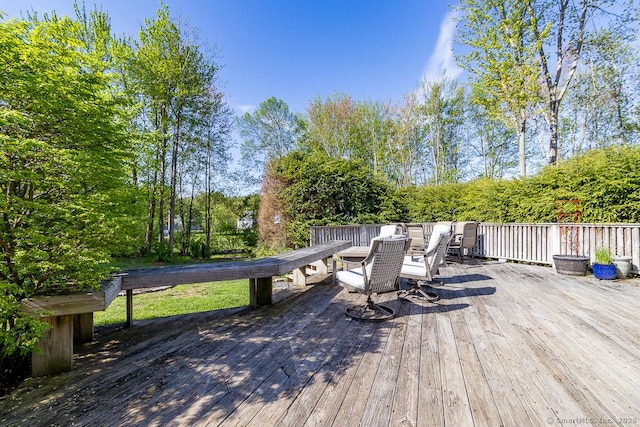 deck with outdoor dining area
