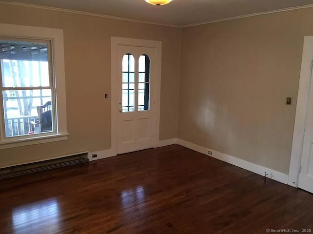 doorway to outside with crown molding, dark wood-style flooring, and baseboards