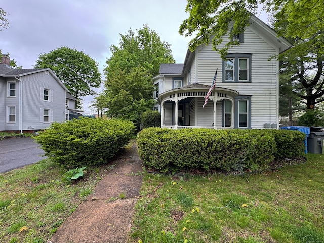 victorian house featuring a porch