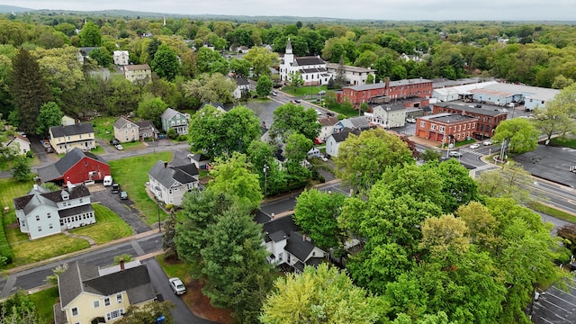 birds eye view of property with a view of trees and a residential view