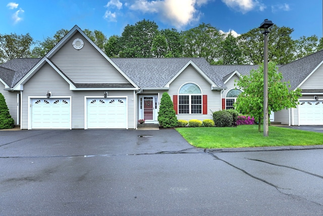 30 Prosperity Ct Unit 25, Southington, CT 06489 - single story home with asphalt driveway, an attached garage, roof with shingles, and a front yard