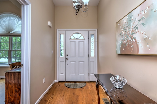 30 Prosperity Ct Unit 25, Southington, CT 06489 - foyer entrance with wood finished floors, a chandelier, baseboards, and a high ceiling