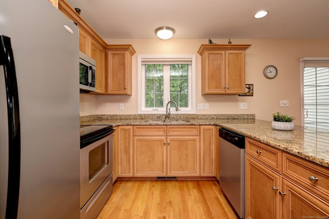30 Prosperity Ct Unit 25, Southington, CT 06489 - kitchen featuring appliances with stainless steel finishes, a sink, light wood-style floors, light stone counters, and recessed lighting