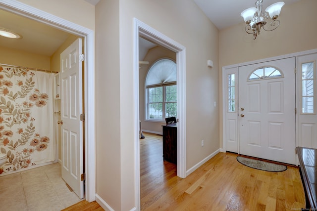 30 Prosperity Ct Unit 25, Southington, CT 06489 - entrance foyer featuring a chandelier, light wood-style floors, and baseboards