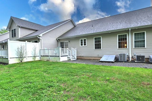 30 Prosperity Ct Unit 25, Southington, CT 06489 - back of property featuring central AC unit, a deck, a yard, and a shingled roof