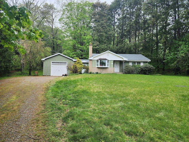 79 Pomfret Rd, Brooklyn, CT 06234 - single story home featuring a chimney, a front yard, a detached garage, and dirt driveway