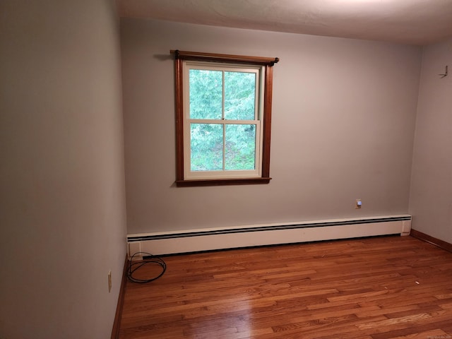 79 Pomfret Rd, Brooklyn, CT 06234 - spare room featuring baseboard heating, wood finished floors, and baseboards
