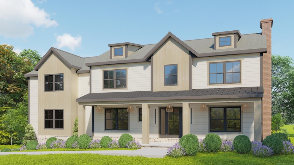 view of front of home with a chimney, metal roof, a porch, and a standing seam roof