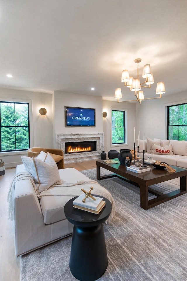26 Hitchcock Rd, Westport, CT 06880 - living area featuring plenty of natural light, a lit fireplace, a chandelier, and recessed lighting