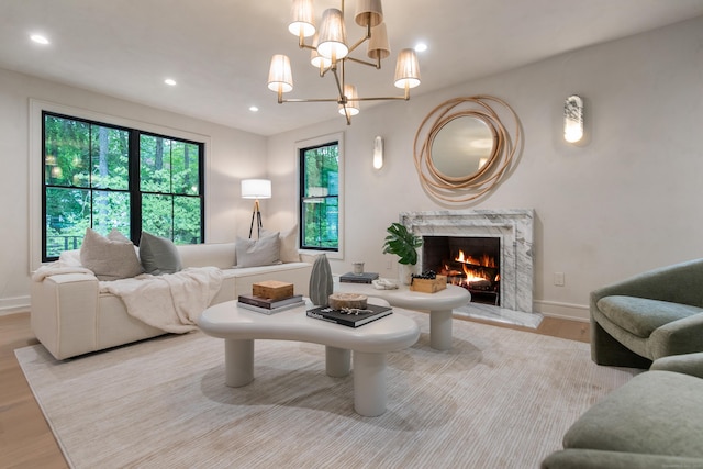 26 Hitchcock Rd, Westport, CT 06880 - living room featuring wood finished floors, a premium fireplace, baseboards, a chandelier, and recessed lighting