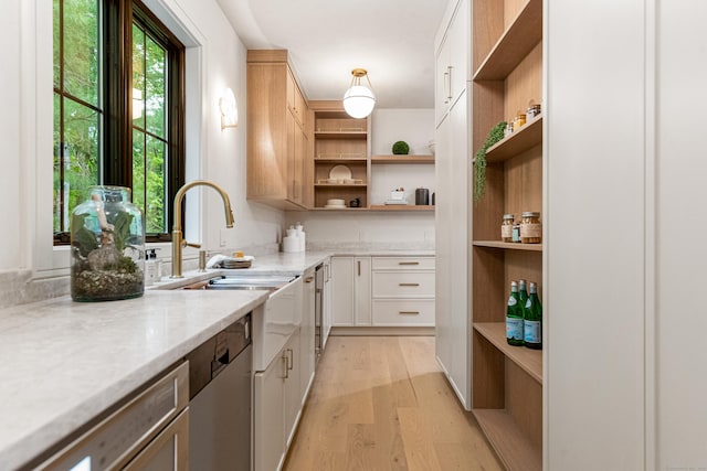 26 Hitchcock Rd, Westport, CT 06880 - kitchen with open shelves, light wood finished floors, white cabinets, and a sink