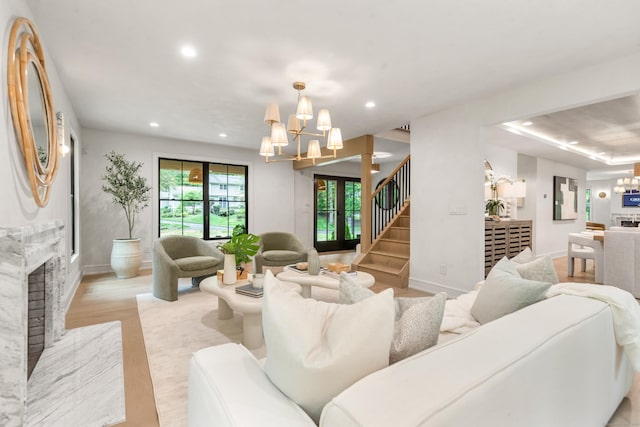 26 Hitchcock Rd, Westport, CT 06880 - living room with a chandelier, recessed lighting, baseboards, light wood finished floors, and a premium fireplace