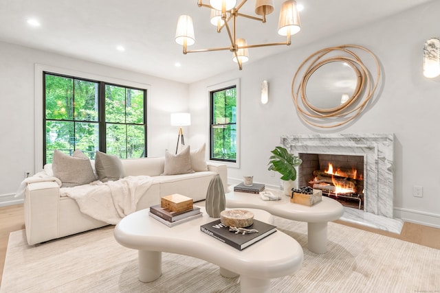 26 Hitchcock Rd, Westport, CT 06880 - living room with a high end fireplace, recessed lighting, wood finished floors, a chandelier, and baseboards