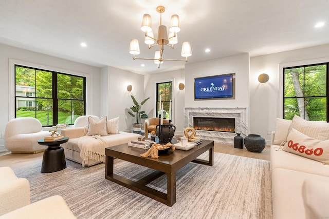 26 Hitchcock Rd, Westport, CT 06880 - living room featuring recessed lighting, a high end fireplace, wood finished floors, and a chandelier