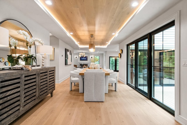 26 Hitchcock Rd, Westport, CT 06880 - dining room with wooden ceiling, light wood finished floors, a raised ceiling, baseboards, and healthy amount of natural light
