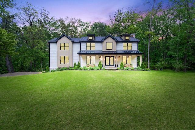 26 Hitchcock Rd, Westport, CT 06880 - modern farmhouse style home with a standing seam roof, a porch, board and batten siding, a yard, and metal roof