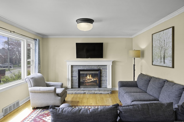 870 Lakeside Dr, Bridgeport, CT 06606 - living room with wood finished floors, ornamental molding, visible vents, baseboards, and a glass covered fireplace