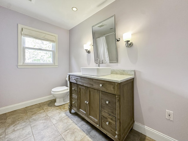 870 Lakeside Dr, Bridgeport, CT 06606 - bathroom with vanity, toilet, and baseboards