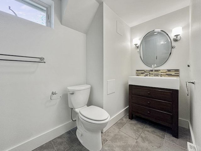 870 Lakeside Dr, Bridgeport, CT 06606 - half bath with vanity, toilet, baseboards, and decorative backsplash