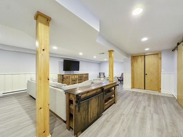 870 Lakeside Dr, Bridgeport, CT 06606 - kitchen featuring wainscoting, light wood finished floors, and a baseboard radiator