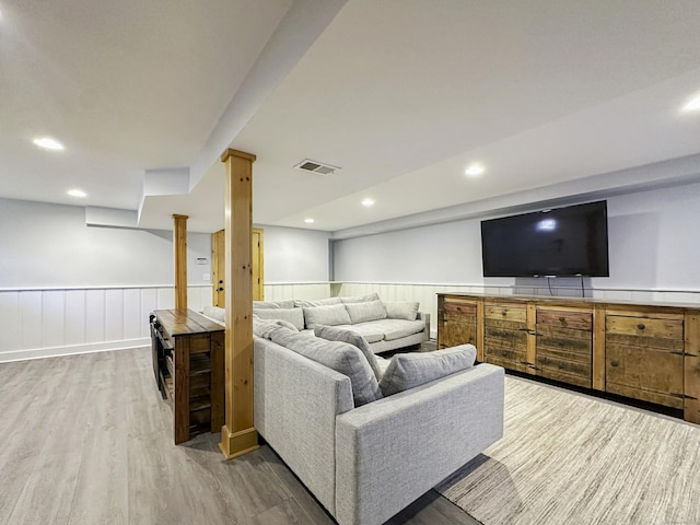 870 Lakeside Dr, Bridgeport, CT 06606 - living room featuring wainscoting, light wood-style flooring, and visible vents