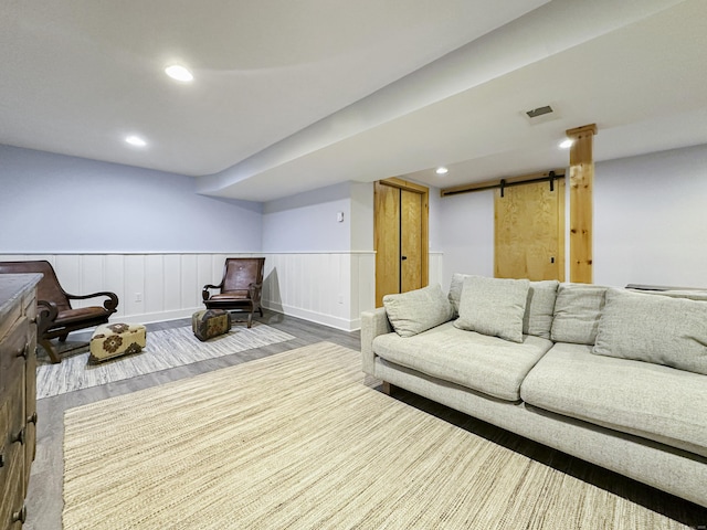 870 Lakeside Dr, Bridgeport, CT 06606 - living area featuring wainscoting, recessed lighting, a barn door, and wood finished floors