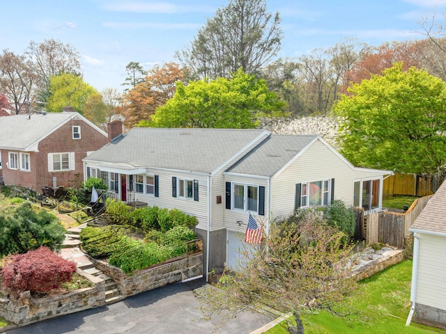 870 Lakeside Dr, Bridgeport, CT 06606 - single story home with a chimney, a shingled roof, and fence