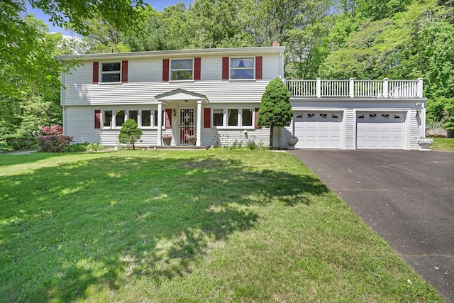 37 Shawnee Rd, Trumbull, CT 06611 - colonial home featuring driveway, a front lawn, an attached garage, and a chimney