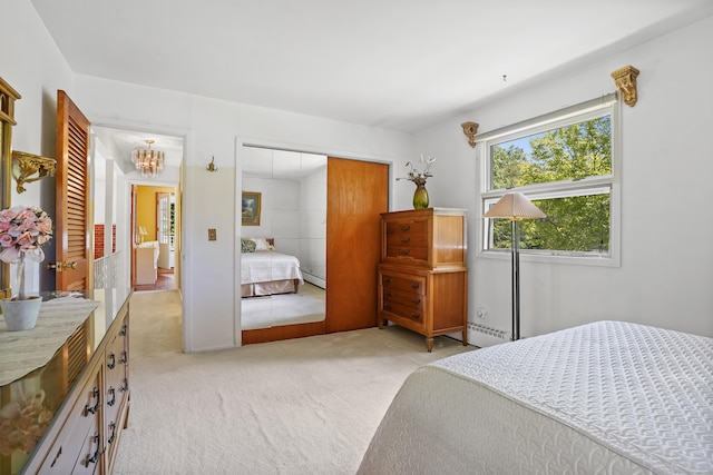37 Shawnee Rd, Trumbull, CT 06611 - bedroom with light carpet, a closet, a chandelier, a baseboard heating unit, and a baseboard radiator