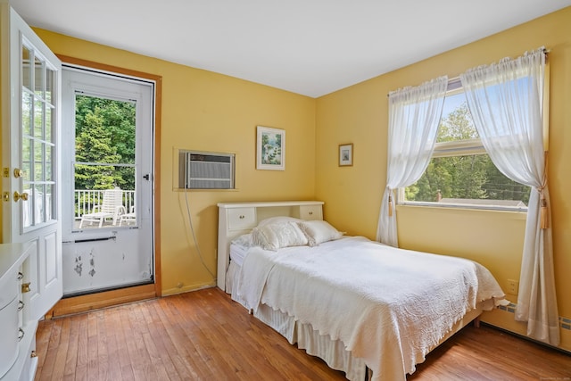 37 Shawnee Rd, Trumbull, CT 06611 - bedroom with baseboard heating, light wood-type flooring, and a wall mounted AC
