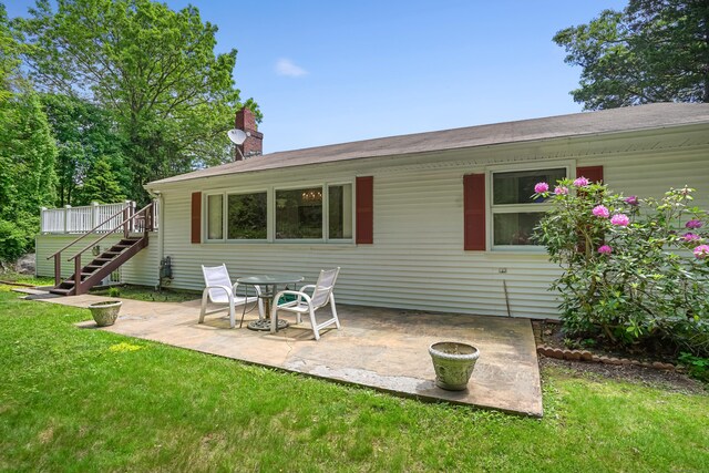37 Shawnee Rd, Trumbull, CT 06611 - rear view of house featuring stairs, a lawn, a patio area, and a chimney
