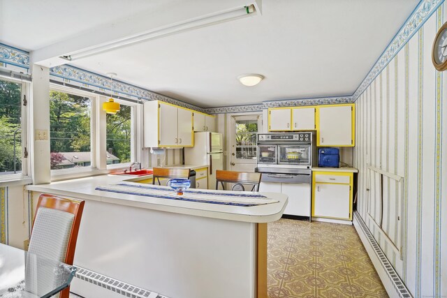 37 Shawnee Rd, Trumbull, CT 06611 - kitchen with oven, wallpapered walls, light countertops, a sink, and dishwashing machine