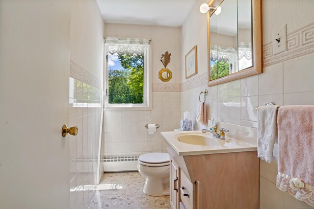 37 Shawnee Rd, Trumbull, CT 06611 - bathroom with tile walls, toilet, vanity, and a wainscoted wall